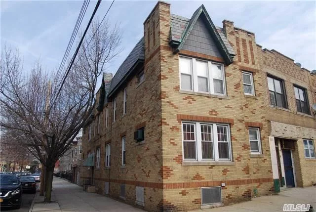 Beautiful 4 Family Semi Detatched Brick With A 2 Car Garage And Corner Building , With One Vacancy