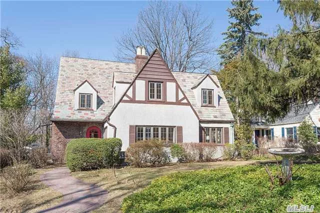 This Beacon Hill Beauty Feels Like Home As Soon As You Enter The Front Door. Bright & Beautiful, This 4 Bedroom, 4 Bath Tudor Has Endless Possibilities. Oversized Flr W Fp. Eik W Brick Detail. Large Fdr W Deck. Window-Lined Office W French Doors. Gleaming Hardwood Floors Throughout. 2nd Fl Deck. Walk-Up Attic & Full Basement. 2 Car Att Garage. Assoc. Beach & Tennis W Fee.