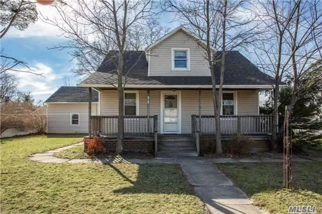 Islip Cape Featuring Charming Front Porch, Hardwood Floors, 4 Bedrooms, 2 Full Baths, Large Fenced Yard. Sky-Lite Eat-In-Kitchen, Updated Exterior Including Roof, Siding Chimney Liner And Garage Doors.