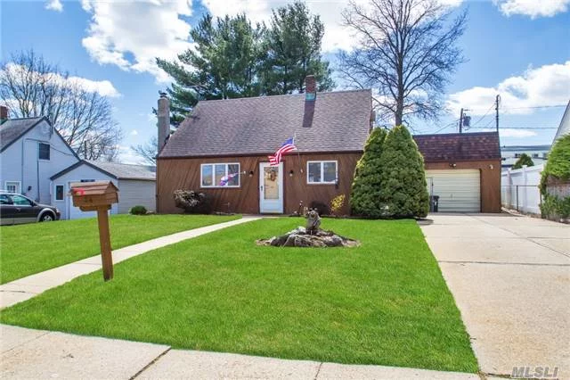 Welcome Home To This Expanded Cape In South Levittown ! This Charming Home Comes With New Appliances, Updated Kitchen, Newer Main Bath, Anderson Windows, Wood Burning Stove, Replaced Burner, Newer Carpeting, Oversized Detached Garage, Inground Sprinklers & More ! Clean As A Pin Outside & Inside, Mid Block Location, Landscaped Property & Macarthur H.S. !