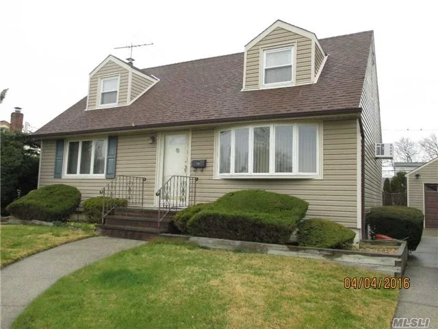 Extended Wideline Cape: Rear Extensions: Eik, Dr, Br (1382 Sqft), Updated Eik W/ Pergo And Newer Appliances. Updated Bths, Roof & Siding @ 9 Years. Replaced Windows; Hw Under Capert 1st Fl. New Carpet In Bsmt. 1.5 Gar On 65X125 Property W/ Paver Patio. Gas To Home! Gas Dryer. Taxes W/ Star @ $7842. Nw Washer/Dryer, Nw 200 Amps, Nw Oil Tank. Convenient To All!