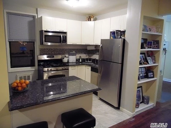 This Is A Junior 4, 1 Bd, 750 Sqft, Lowest Maintenance $567.-. Spacious, Gra-Kitchen, Stainless Steal Appliances, Multiple Closet Spaces, Laundry In Basement, School, Library, Supermarket, Banks, Restaurants, Stores., P.S.117, Van Wick Expressway And Queens Blvd, 2 Blocks To E & F Train 20 Min To Manhattan.