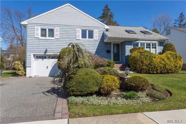 Lovely Midblock Split Level Home In Quiet Neighborhood. This Very Bright Home Features High Ceilings, Wood Floors, Gas Cooking, Cac, Fenced Yard, Upgraded Electrical Service, New Windows, 5 Skylights, Ig Sprinklers, Syosset Schools!