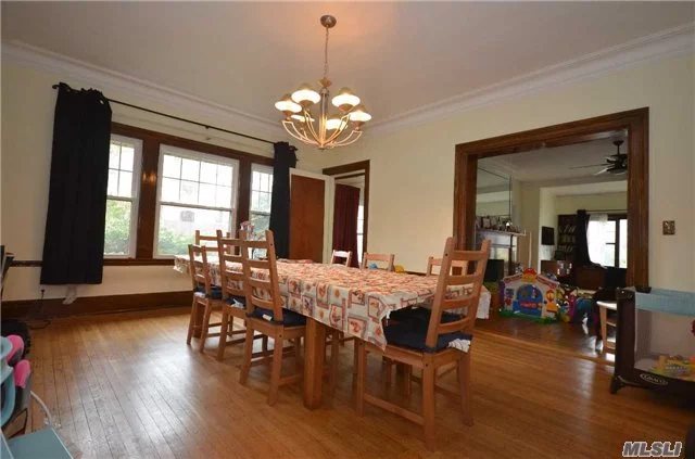 Large Tudor House With Ample Living Area Located In The Heart Of Kew Gardens. Six Bedrooms, Three And A Half Baths, Two-Car Garage. Short Walk To Transportation.