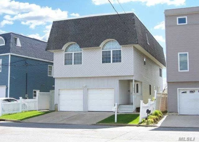 Amazing Location With View Of Bay. Perfect Sunsets, 30 Second To Bay. Amazing 3 Level Contemporary House With Hardwood Floors Throughout. Updated Baths, Gourmet Kitchen With Viking Stove, Sliders Off Dining Room And Upstairs Den Onto Decks Overlooking The Tideway River. Room For An Extended Family. Move Right In!