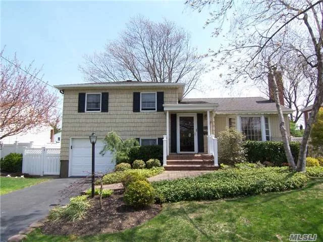 Expanded Split Level In Mass Park, On Quiet Mid-Block Location.Features Living Rm With Cathedral Ceiling/Fireplace, Eik W/Updated Stainless Steel Appl, Formal Dr, Extended Family Rm, Bonus Rm/Play Rm, Master Suite W/Walk In Closet And New Bath, Hardwood Floors, Professionally Landscaped/Brick Patio, Igs And More!