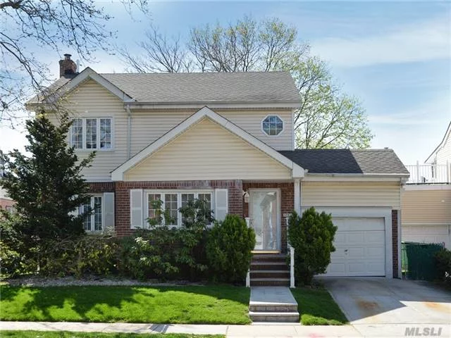 Spacious Custom 4 Bedrooms Colonial House, A Rare Find With Open Layout. Fabulous Living Space, Huge Master Bedroom W/Walk In Closets. Perfect For Large Family. A Great Flow For Entertaining With Huge Backyard. Prime Fresh Meadows Location ! Must See.