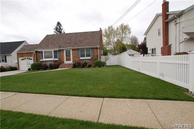 Charming Cape, New Roof, Front Porch, Walkway & Rear Patio, Oak Kitchen Cabinets, Recent Remodeled Bath, Updated Electric, Close To Shopping & Transportation, Alarm System, Inground Sprinklers, Dog Run, Garden, 4 Ductless A/Cs & 1 In-Wall A/C.