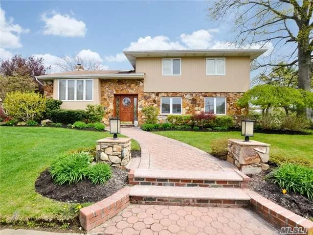 Welcome To This Expanded Syosset Split Level Home. Reminiscent Of An Italian Villa.Home Is Abundant In Quality And Attention To Every Detail.Enter This Home And Be Prepared For A Truly Special Treat. Spacious Ground-Level Family Room W/Fplace And Custom Oak Wet Bar.Gourmet Granite Kitchen, Generous Sized Dining Rm And Living Rm. A Tranquil Outdoor Oasis Awaits You.