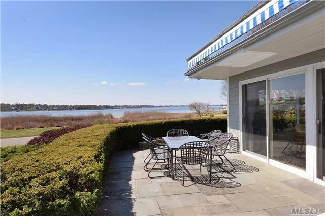 Rarely Available Direct Water View Home Positioned To Capture Exquisite Sunsets Over Manhasset Bay. Access To A Private Sandy Beach W/Mooring Just Across The Way. Open Floor Plan Offers 3 Bedrooms Including Master Suite On The Main Floor And Wonderful Gathering Spaces With Views.