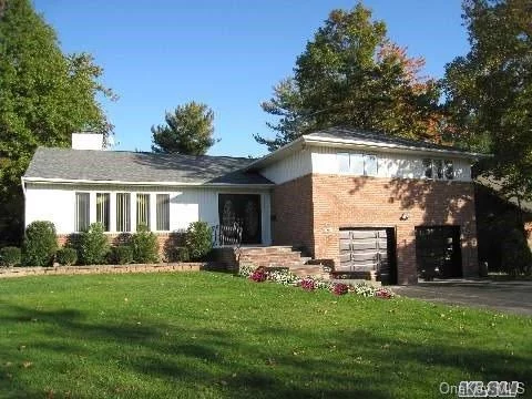 Spacious And Sunny 5 Bedrooms 3 Baths Brick Split In Herricks School!All Wood Floor, Gourmet Kitchen, Living Room, Formal Dining Room, Eat In Kitchen With Access To Backyard. Steps Down To Kitchen Is The Family Room. Mid Block, Beautiful Tree Lined Street.