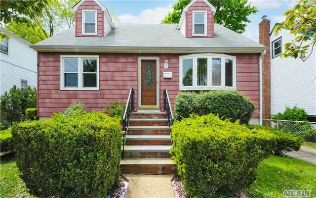 Solid & Charming Cape 4 Bedrooms 2 Full Bathrooms 50X100 Parcel Wood Floors Throughout Detached Garage Full Basement With Outside Entrance Close To Beach, Pool, Park, Bus To Lirr Great Location In Desirable Pw School District