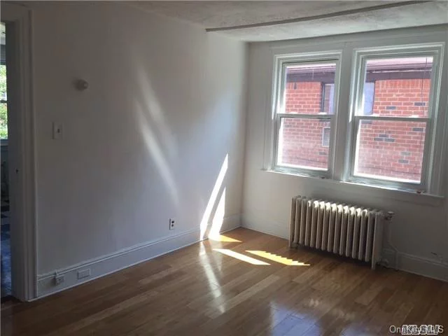 One Bedroom Apartment With Update Eat-In Kitchen And Bath, Beautiful Hardwood Floors & Painted. Move Right In . Close To L.I.R.R, Buses & Northern Blvd.