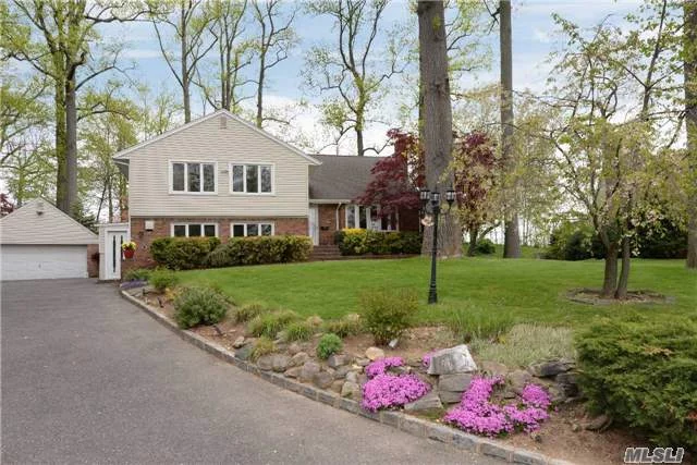 This One Has It All! Centrally Located On Oversized Property Peppered W/Mature Trees And W/Stone Terrace & Distant Water Views Across Hempstead Harbor.Home Has An Array Spacious Rooms Including Cook&rsquo;s Kitchen W/Handcrafted Tile Opening To Family Room With High Ceiling. Five Bedrooms, 2nd Den, Artist&rsquo;s Studio W/Sep. Entrance + Basement. 2-Car Detached Garage W/Storage Loft.