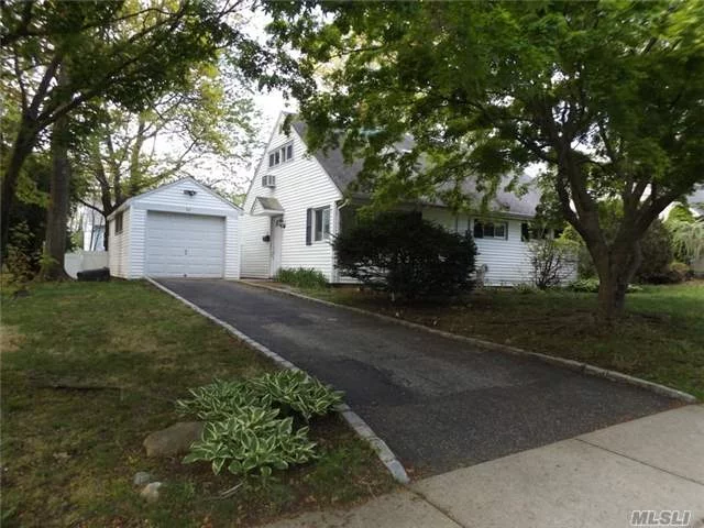 Charming 4 Bedroom Cape Close To Everything. Updated Kitchen, Great Backyard, Garage.