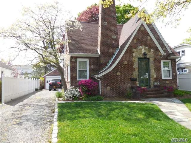 Beautiful, Classic Brick Tudor With Old World Charm And Modern Amenities.Front Door Opens To Cathedral Foyer/Guest Closet, Lr/Stone Fireplace, Separate Formal Dining Rm, New Custom Kit With Maple Cabinets, Granite Counter Tops, S/S Appliances/Gas Cooking, New Gas Heating And Hot Water Heater, New Windows, Updated Roof.Fin Basement, 2 Car Garage.Nice Architectural Details Throughout