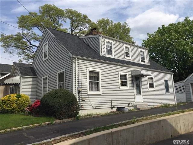 Much Desired Park Section Of P.W. Walk To School, Town, & Lirr, A Quiet Tree Lined Is The Host To This Well Appointed, With Oodles Of Charm Cape. There Are Hardwood Floors Throughout And The Cooking Is Gas. While The House Needs Some Updating And Cosmetic Changes It Reeks Of Home Sweet Home