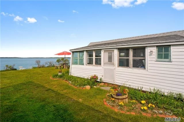 Greenport. Two Bedroom Bayfront Cottage On Magical 82 Acre Setting A Seasonal Co-Op With Sandy Beach, Marina And Park Like Open Spaces. Unmatched Views And Location - Unique Offering.