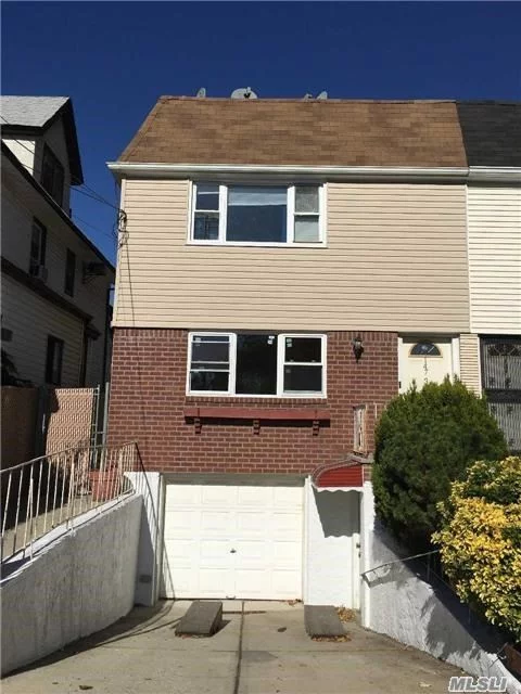 This Property Is Conveniently Located In Downtown Flushing, Convenient To All, Legal Two Dwelling Semi-Detached, Each Floor Is 1000Sqft 3 Bedrooms Over 3 Bedrooms, 2 Separate Entrance Full Basement With An Attached Garage, Bright & Sunny, Lots Of Window, Tax $6527.