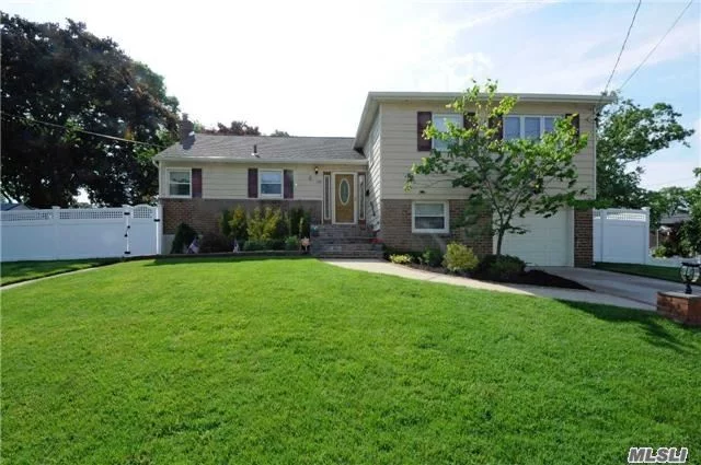 Beautiful 4 Br 3 Bth Split In Sd#23 Updates Include: Windows, Kitchen, Baths, Gorgeous Hardwood Floors, 200 Amp Electric, Gas Heat, Separate Hw Heater, Family Rm. + Full Basement. Professional Landscaped. Never-Ending House, Room For Extended Family Or Room For Mom With Proper Permits.
