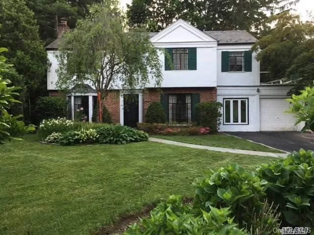 Charming Colonial With Many Updates, 3/4 Bedrooms Plus Office, Balcony, Den Plus Great Room W/ Skylight, Hardwood Throughout, Marble Fireplace, Marble Master Bath, Private Yard With Bluestone Patio, New Burner & Hot Water, Convenient To All,  Americana Shopping Center! Manhasset Schools!