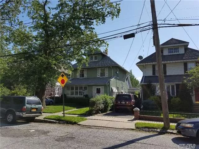 Beautiful & Charming Large Det, 1 Family In Old Bayside Village 4 Block Walk To Lirr. On Quiet, Tree-Lined Street. Restored English Tudor Style Wood On Doorways & Ceilings In Huge Lr. & Fdr W/ Working Fireplace. Eik 1/4 Bath 1st Fl. 3 Bdrms On 2nd Fl. Plus Full Bath. 1 Bdrm In Attic. Private Backyard. 1 Car Det. Garage Pvt. Driveway 1Yr. Old Gas Boiler. New Roof (@4 Yrs)