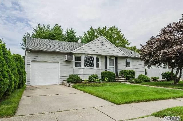 Well Maintained Spacious Ranch Style Home 3Br, Full Finished Basement W/Ose, Lg Lr, Lg Mbr, Large Eat In Kitchen-Gas Cooking, Hardwood Floors Thruout, Updates- Newer Roof, Siding, Windows, Elec 150Amp, Attached Garage, Professionally Maintained Private Backyard & Much More