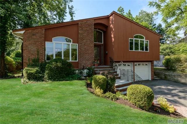 This Modern Split Level Home Offers A Gracious Entry With Soaring Vaulted Ceilings, Hardwood Floors And An Abundance Of Natural Sun Light Throughout. Features Include A Spacious And Open Floor Plan With A Formal Living Room With Fireplace, Dining Room, Updated Kitchen With Granite Countertops Adjacent To A Great Room With Sky Lights, Fireplace And Sliders To A Patio.