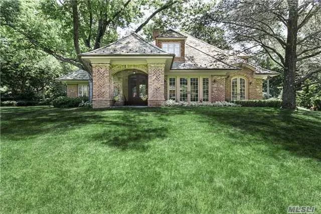 Custom Built In 2004, 6Br, 6.5 Ba All-Brick Home Is Both Private & Gracious, Set Above Cascading Front Lawn & Approached By A Cobblestone Drive. Aesthetically Pleasing, Architecturally Important, & Of Enduring Value Evidenced By The Quality Of Its Materials & Workmanship. Grand Rooms W/Tall Windows Overlooking The Gardens Arrayed In A Floor Plan That Is Distinctly Modern.