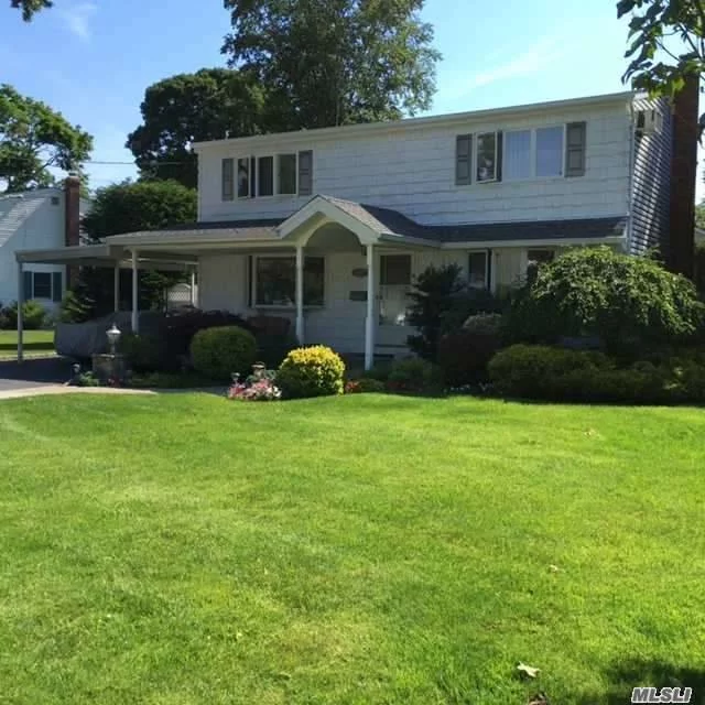 Great Spot In Wantagh Woods! Skylit Colonial On Large Lush Lot, In Ground Pool With New Liner 6/16. Six Ductless Air Conditioning Units. Full Finished Basement (Den/Playroom,  Laundry, Utility)
