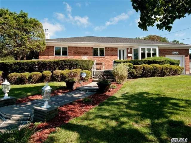 Move Right In! Designer Done! All Re-Done Within Last 6 Years! Granite/Stainless Eat In Kitchen With Vaulted Ceiling & Skylight, Stone & Slate Baths, All Wood Floors, New Doors, Amazing Finished Basement With Playroom, Bath & Bedroom. Expanded Driveway. Syosset School District