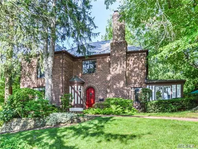 Beautiful Tudor With 5 Brs And 3 Full Baths In North Strathmore. All Large Rooms W/ High Ceilings Throughout. Kitchen W/Brkfast Room, Formal Dining And Living Room With Tudor Details. Unique Features Include Walkup Attic & Generous Closet Space & Lge 2 Car Garage. New Slate Roof, Upgraded Electrical, Inground Spklrs Unico Cac. Close To Town, Train, Northern Blvd.