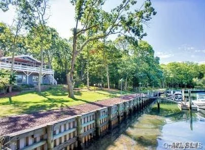 A Must See Waterfront Home On A Deep Water Inlet With Direct Access To The Bay. Docking For Two Boats Up To 50+ Feet, 4 Bedrooms, 3 Baths In Main Home Plus A 3 Car Garage With Room Above With 1.5 Baths, Deco Turf Tennis Ct, All Sited On 1.19 Acres Of Sheer Privacy. Includes Access To Bay Beach. There Is A 16X32 Waterfront Pool Permit In Place W/10X32 Patio.