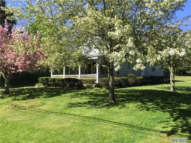 Quintessential North Fork Farmhouse With 3 Bedrooms, 1 Bath, & Wrap Around Covered Porch, In A Prime Cutchogue Location Close To Nassau Point Park And Beach And Award Winning Wineries.