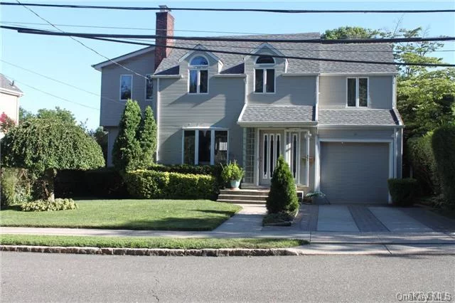 Beautiful Sunny Colonial L/R, F D/R With Fireplace, 3 Bedroom 2 1/2 Bath, Eik, Mbr With Private Balcony, Hardwood Floors On First Floor. Lovely Backyard, One Car Garage. Roslyn School District