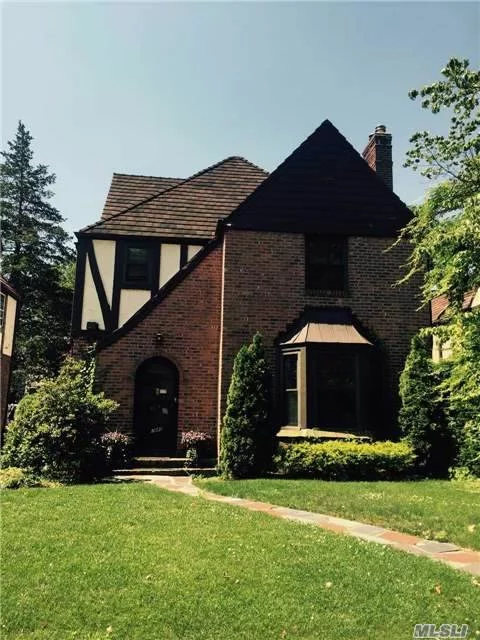 Brick Tudor With Large Eat-In Kitchen, 1/2 Bath Spacious Living Room With Entryway Into Formal Dinning Room. Second Floor Has Tree Bedrooms, One With En-Suite Bath And Second Full Bath. Full Attic With A Small Bedroom. Beautiful Backyard With A Patio
