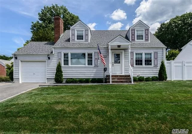 Pristine Expanded Cape.Completely Renovated With Radiant Heat Throughout The First Floor, New Kitchen W/Stainless Steel Appliances , 2 New Baths, Sunroom , Custom Wood Doors, Crown +Picture Molding, Heated Garage, Navian System, Professionally Landscaped+ Fenced Private Yard. Move Right In!