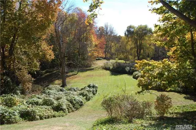 Set Way Off The Road Is This Quaint Colonial Nestled On Over 4 Acres Of Gardens, Lawns And Small Pond. Charm Through Out With Fireplaces, Sun Porch, Den With Built Ins. 1st Floor Master Bedroom. In Ground Pool And Tennis Court (Needs Work). Prospective Purchasers To Verify Taxes And Information.