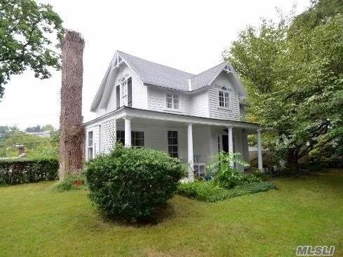 Charming Colonial With Partial Water Views. Entry Foyer, Living Room With Fire Place & Reading Nook Overlooking The Water. Eik, Formal Dining Room, Two Full Baths, Two Large Bedrooms, One Small Bedroom/Nursery/Office. Part Unfinished Basement W/ Outside Entrance.