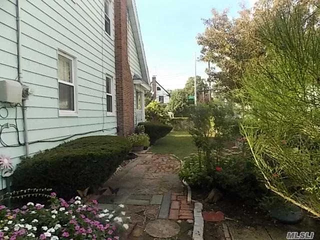 Beautiful Updated 4 Bedroom, Corner Colonial In Queens Village, New Kitchen, Stainless Steel Appliances, Granite Countertops And Working Fireplace. Front Porch With Swing And Wonderful Backyard Perfect For Entertaining On Those Hot Summer Days. New Plumbing Throughout. Boiler And Hot Water Tank Less Than 1 Yr Old, Roof Is Only 3 Years Old.