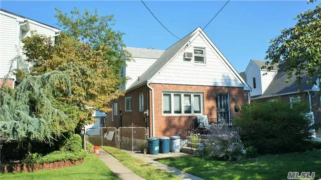 Cape House Situated In A Mid-Block Located In Nice & Quiet Neighborhood. Close To All - St. John U, Restaurant, Supermarket, Bank, Union Tpke, Buses To E & F Train, Etc.  2 Bedrms, Living Rm, Eik, 1 Full Bath On 1st Fl. 2nd Fl Has 2 Large Bedrms W/ Hardwood Floor. Long Driveway +1 Det Garage. Appliances, Water Heater, And Roof Less Than 5 Years Old. School District #26.