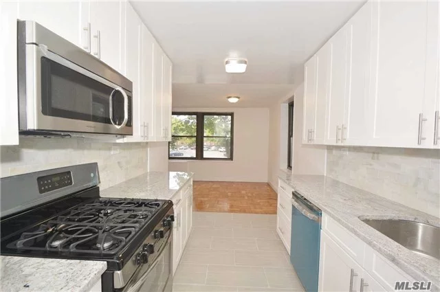 Sponsor Owned! No Board Approval Needed On This Spacious Corner 3 Bed./2 Bath, 1500 Sq. Ft, Newly Renovated Throughout. Central Air/Heat Reserved Parking Included. Conveniently Located, Express Bus To City & Flushing Right Outside Your Door. Minutes To The Lirr, Top S.D. 25. A Must See!