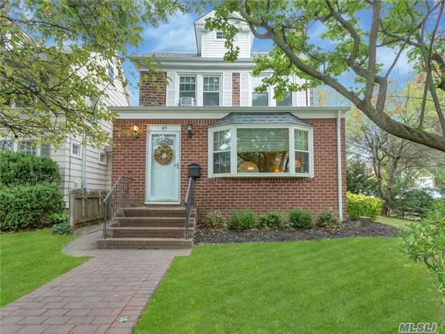 Commuters Delight! Walk To Lirr & Town From This Brick Colonial Featuring Living Room W/Wood Burning Fpl, Formal Dining Room, Large Updated Eik W/New Stainless Steel Appliances. All Hardwood Floors, Walk-Up Attic, Great Storage Space, Gas Heat, New Windows & New Roof.