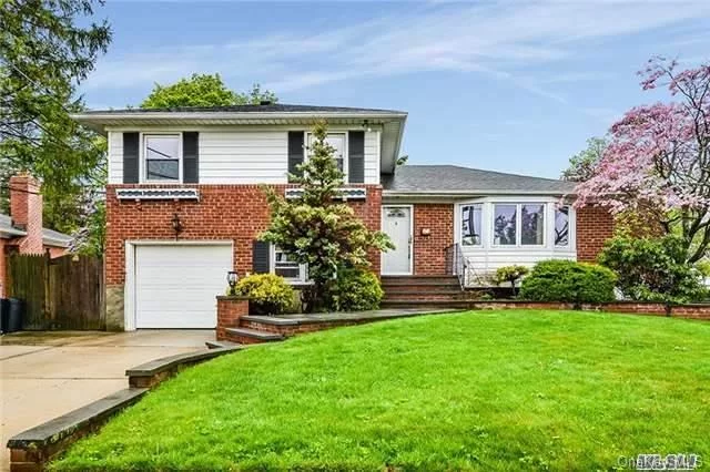 Large Split In One Of The Best Locations In Hicksville! Updated Kitchen And Bath. New 200 Amp Electric. Four Bedrooms. 2 Full Baths, Hardwood Floors. Central Air And Gas Heat And Gas Cooking. Den With Fireplace. Master Bedroom With Master Bath.