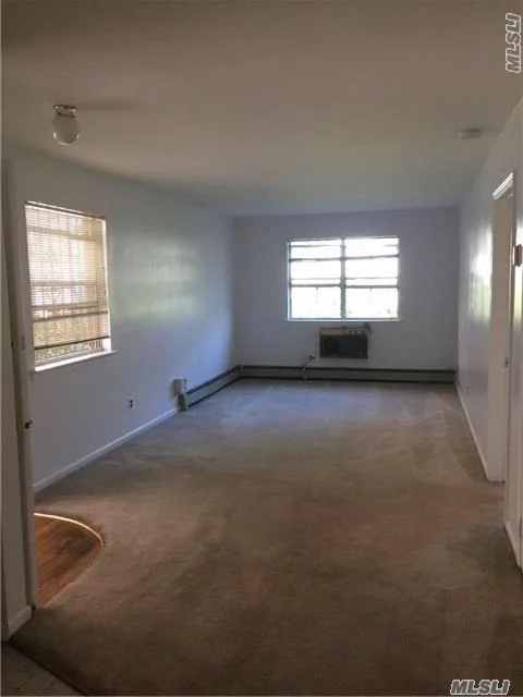 Spacious One Bedroom Apt On 1st Floor, Large Living/Dining Room, Kitchen, Large Bedroom With Walk In Closet, Full Bath. Close To All, Walk To 63 Dr Subway. Steps To Shops, Restaurants, Mall, Etc. Zoned For Ps 174, Jh 190