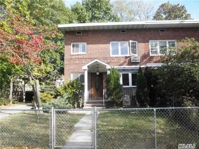 Well Kept Solid Brick Semi Attachment Two Family ! Excellent Investment Property.Good School Dist #26. Over Sized 39X100 Property With 2 Car Garages. Walk To Shops , Park & Q27 Bus To Flushing.