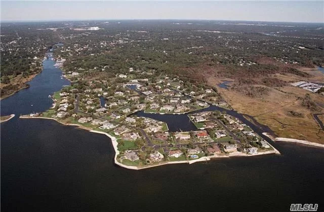 The Final Vacant Lot In The Moorings ! Here's Your Opportunity To Build Your Dream Home On This 1 Acre Water-View Lot. This Prestigious 24/7 Gated Community Is Home To A Private Marina & Tennis Courts. Located Along The Great South Bay The Moorings Community Is Only Minutes To Fire Island And 50 Miles To N.Y.C. Or The Hamptons.