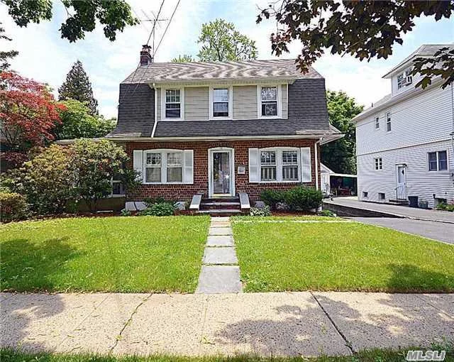 Charming Center Hall Colonial * Just 4 Minutes & 2 Blocks From Long Island Rail Road * 3 Levels Of Living * 3 + Bedrooms * 2.5 Newer Marble Baths * Living Room With Granite Fireplace * Huge Eat In Kitchen * Formal Dining Room * Enclosed Screened In Side Porch * Off Street Parking For 4 Cars & 1 Car Garage * Walk Out Lower Level To Back Yard Patio * Sweet House