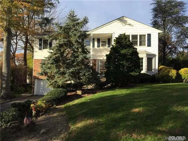 Large Center Hall Colonial In The Village Of Flower Hill.