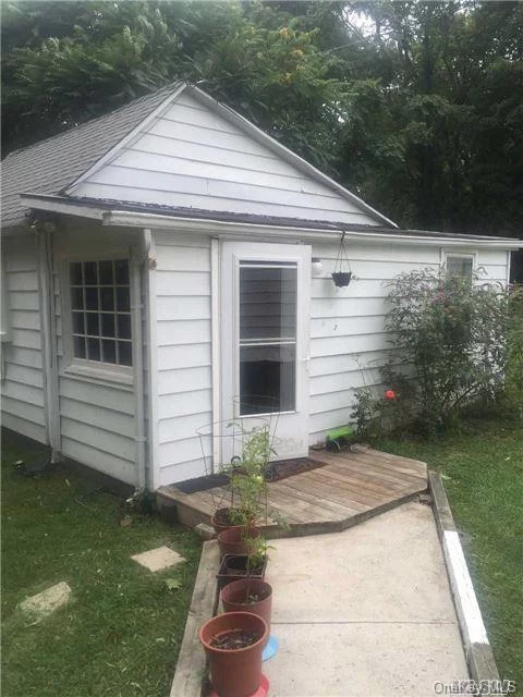 Adorable 1 Bedroom Cottage Set Back On Huge Property! Features Lr, Eik, 1 Br And Full Bath.